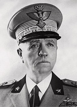 A black and white portrait photo of Governor Badoglio, wearing a military uniform, with bushy eyebrows and a small moustache, looking slightly off to the right.